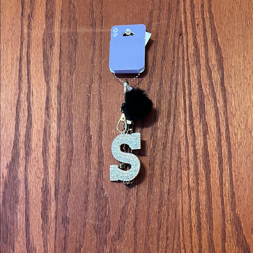 Claire's Silver Initial Key Holder with Black Pom Pom